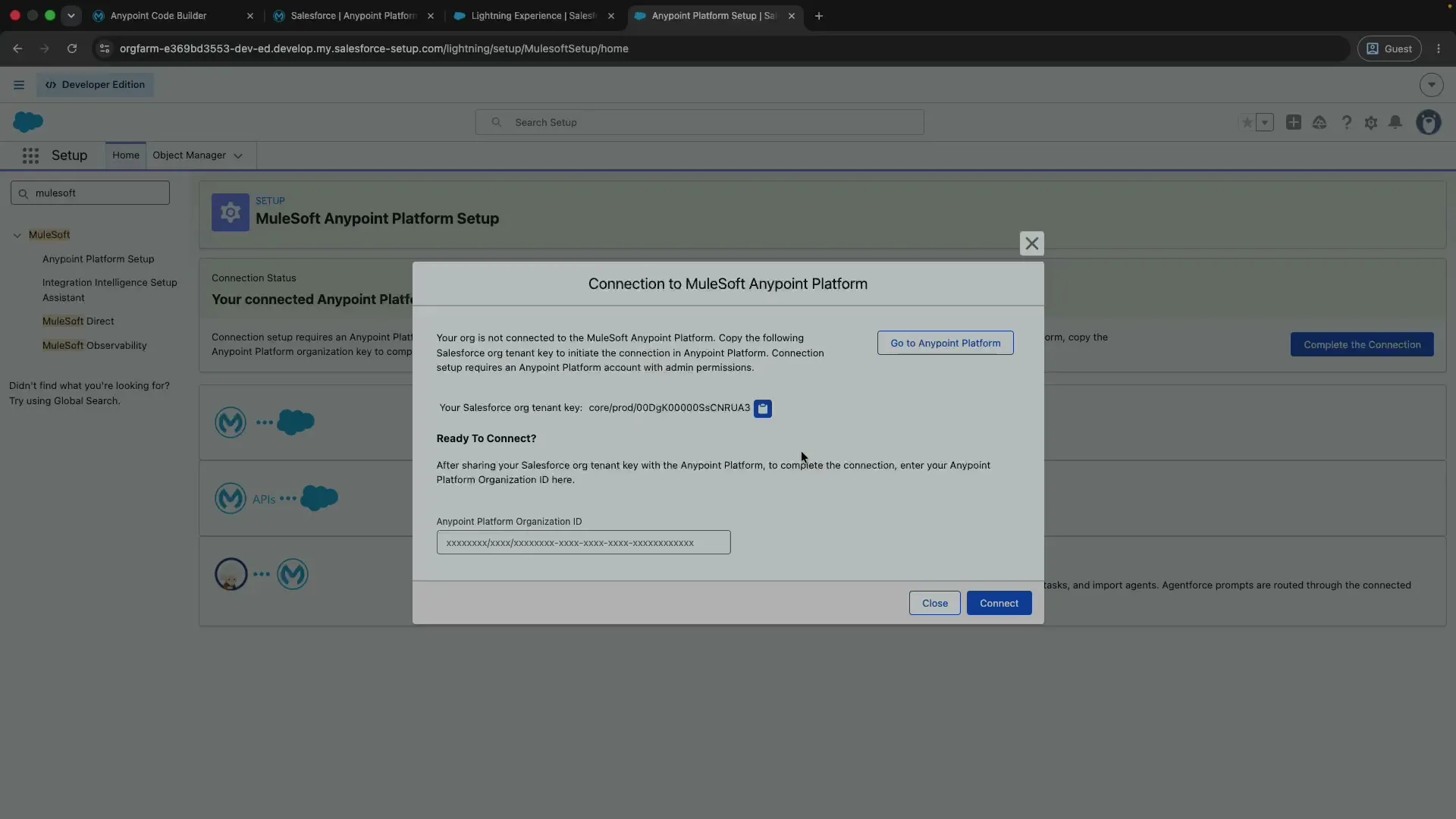The Connection to MuleSoft Anypoint Platform dialog showing the Salesforce org tenant key to copy.