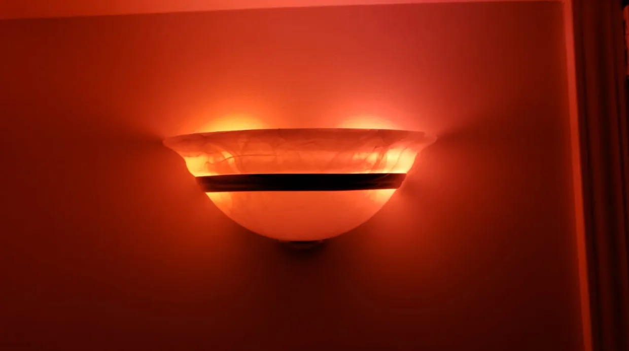 A Philips Hue wall light glowing red after the calendar event triggered the applet